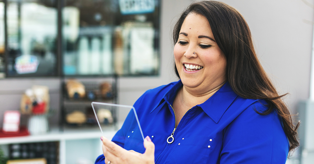 A woman using AI technology on a tablet