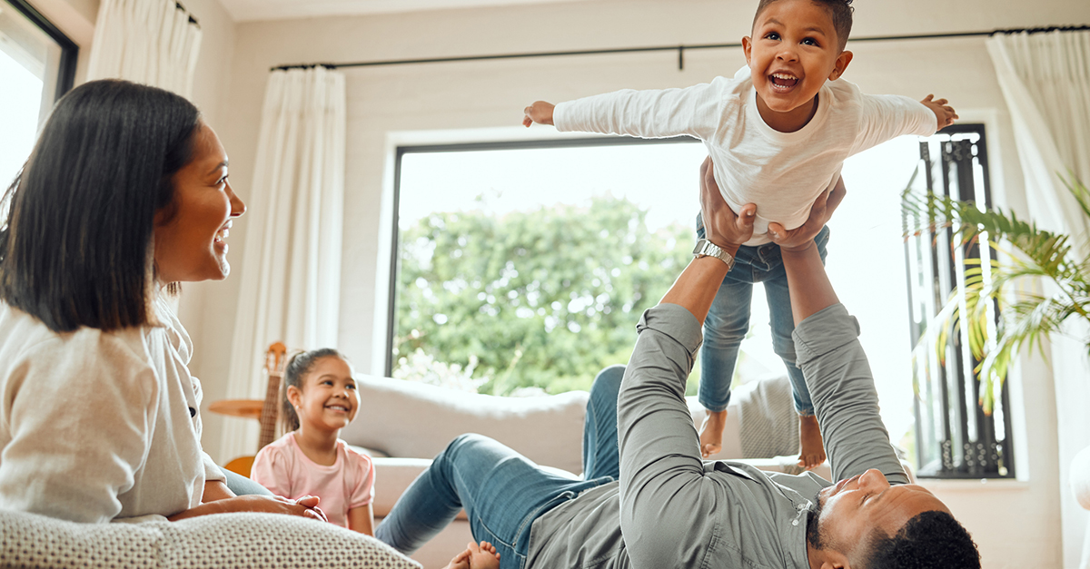 A young family playing at home.