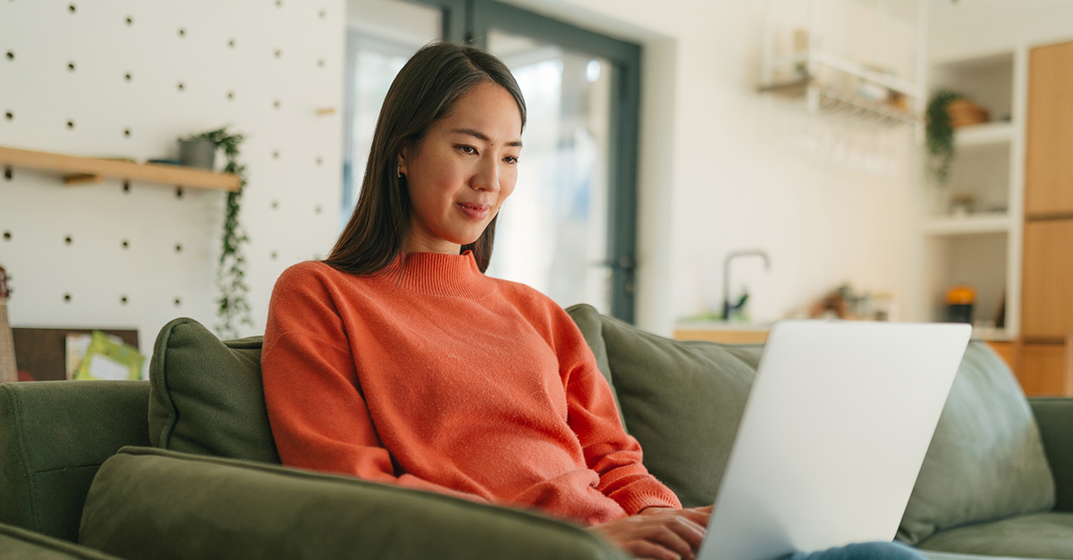 A woman at home on her laptop